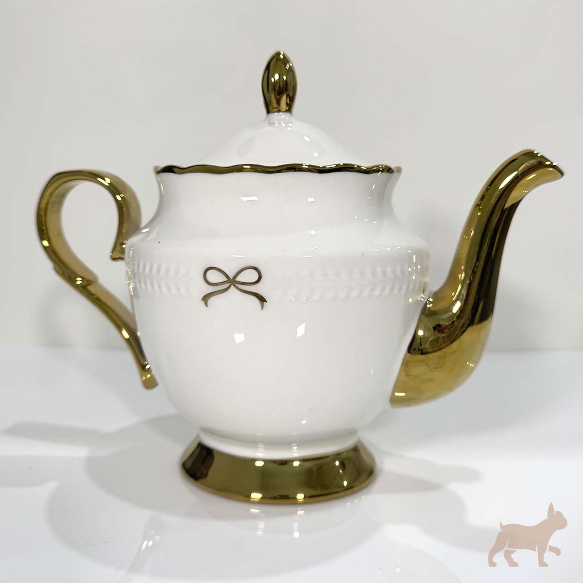 Juego de té de porcelana con moño